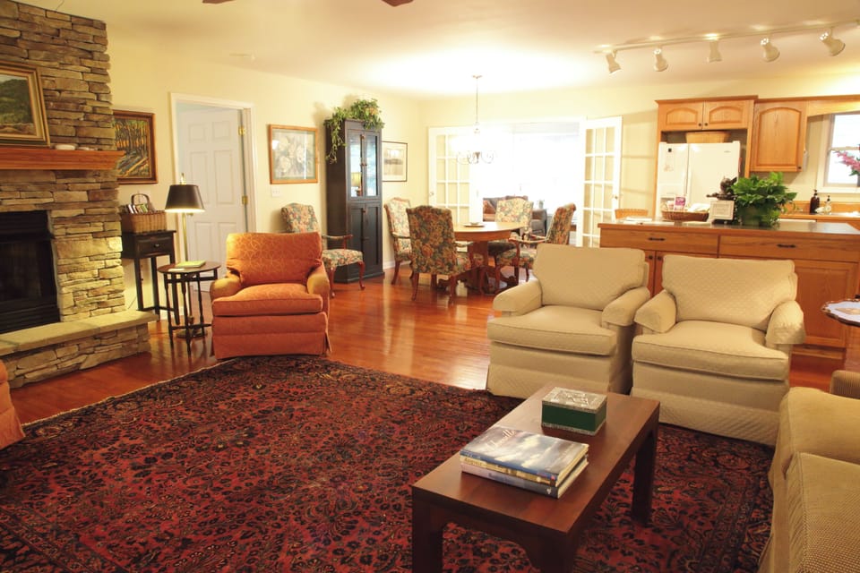 Lovely great room with fireplace, comfy seating, dining area & huge kitchen.