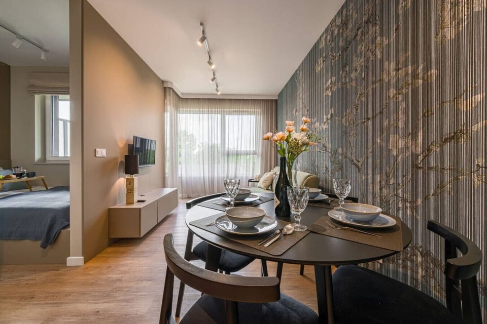 Living Room with Sofa, Smart TV and Dining Table | Book Now with RENTUJEMY.COM