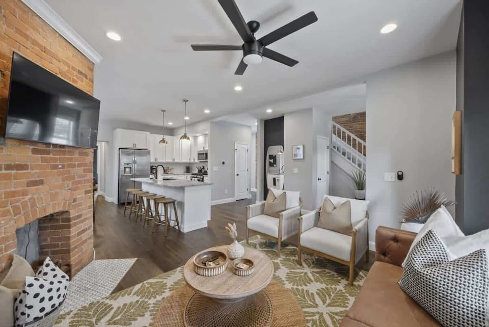 Spacious open-concept living room leading into the bright kitchen & dining area