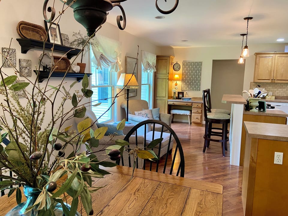 Open floor plan with kitchen, dining, and seating area