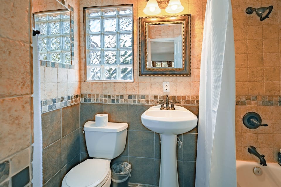 Bright and modern, the bathroom is a peaceful retreat for refreshing starts and relaxing finishes.