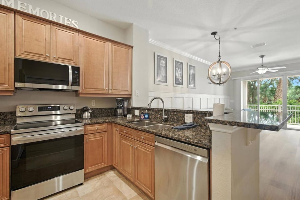 Spacious kitchen featuring stainless steel appliances and an airy open-concept design.