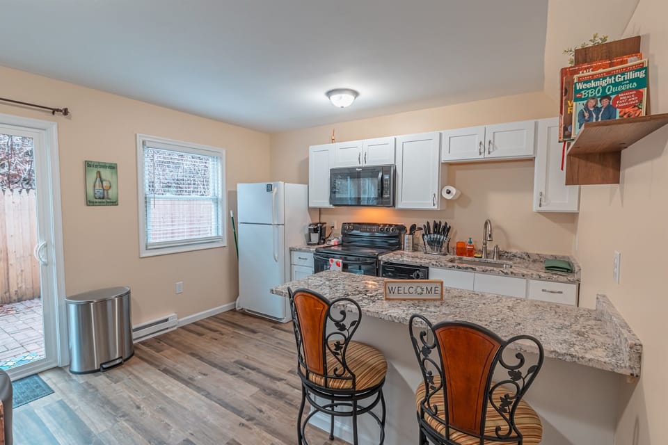 Modern kitchen featuring a sleek bar counter—perfect for casual dining and socializing.