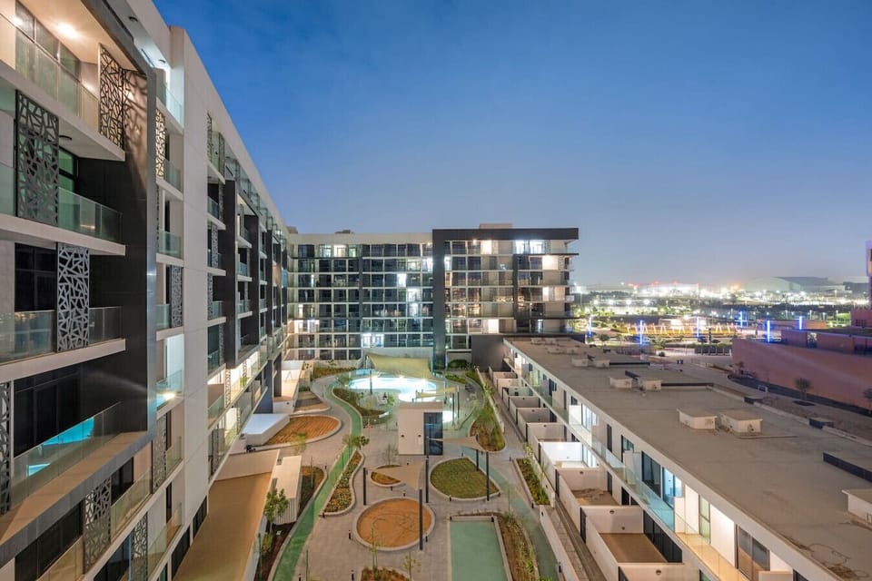 Balcony View: Enjoy stunning views of the courtyard and vibrant cityscape at night!
