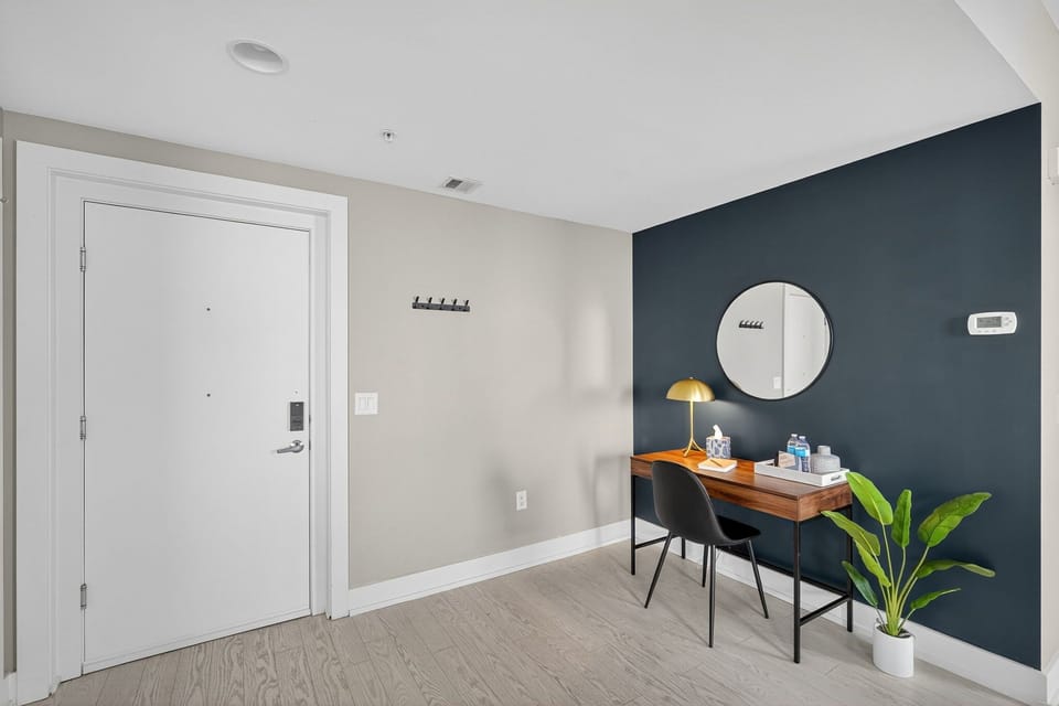 Need to get things done? A stylish desk with gold accents, comfy chair, and task lighting provides a quiet, productive nook.