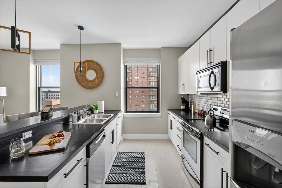 A functional and beautifully designed kitchen with bar seating, full-size appliances, and all the essentials for your stay.