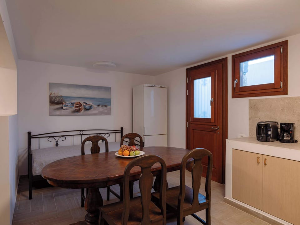 Cozy dining space with warm lighting—ideal for shared meals or planning your island adventures.