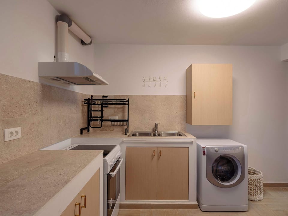 Compact, functional kitchen setup with all essentials for long or short stays.