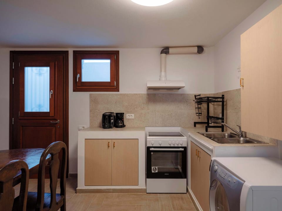 Fully equipped kitchen with modern appliances for convenient cooking during your stay.