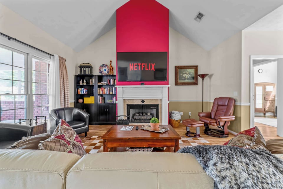 Relax with your group in this cozy space with plush seating and a large smart TV! 