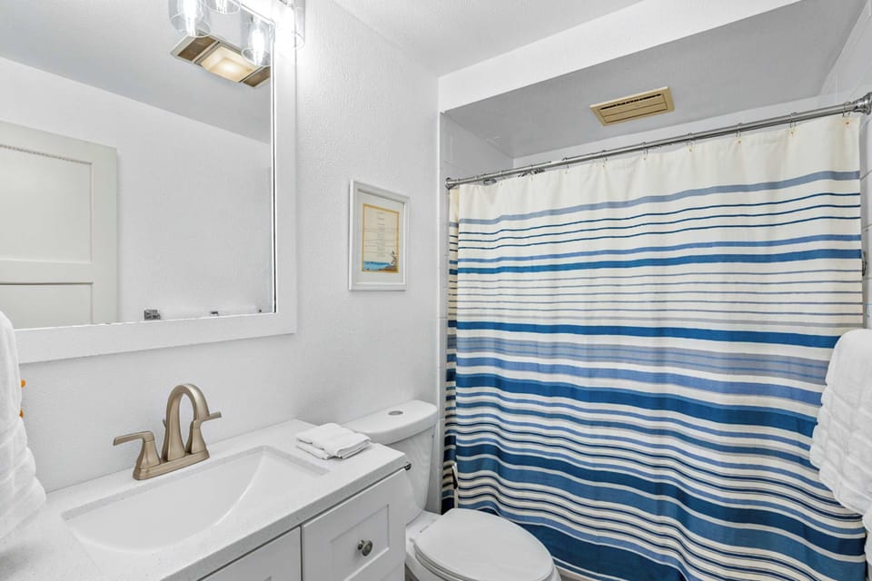 Full bathroom with tub and shower.