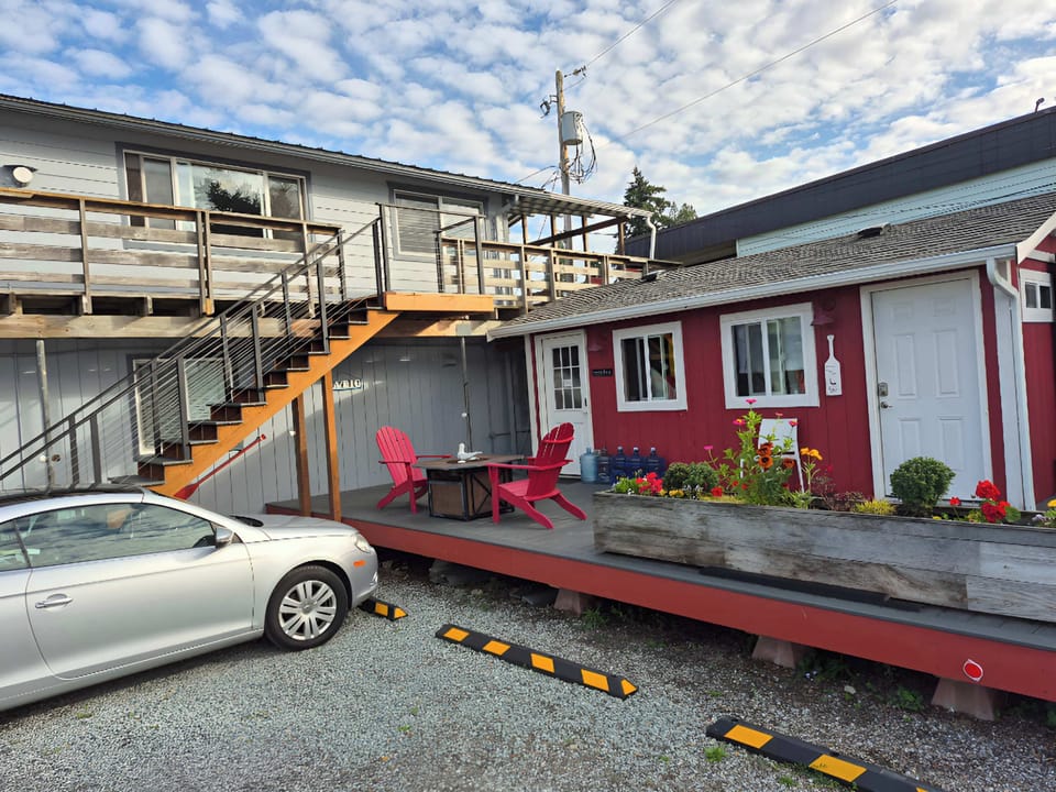 Park here;  Use these stairs to your suite (on left).  The red building is our laundry room and you are welcome to use it (coin op)