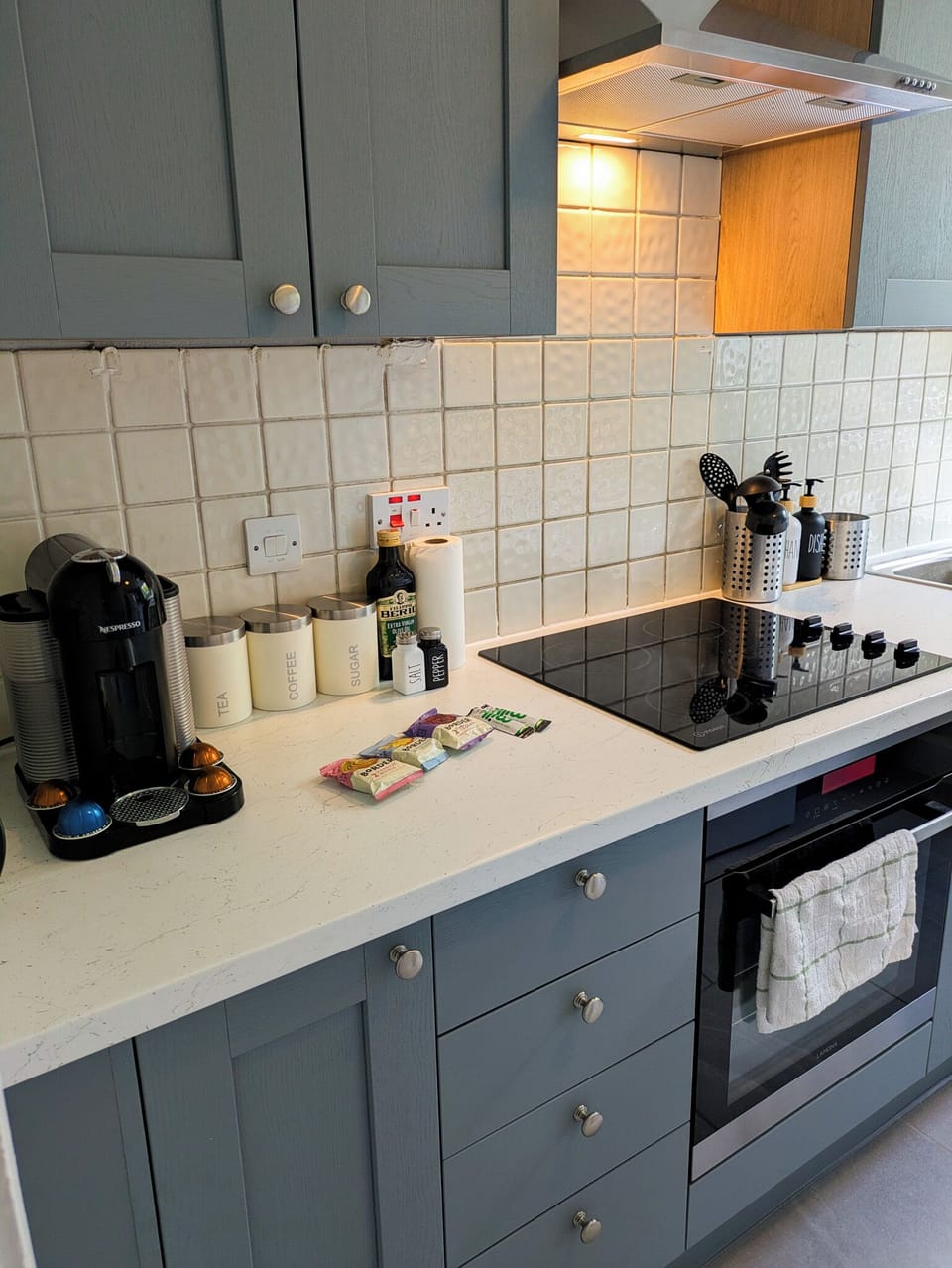 spacious kitchen, coffee machine, fridge, microwave, stove, toaster, oven