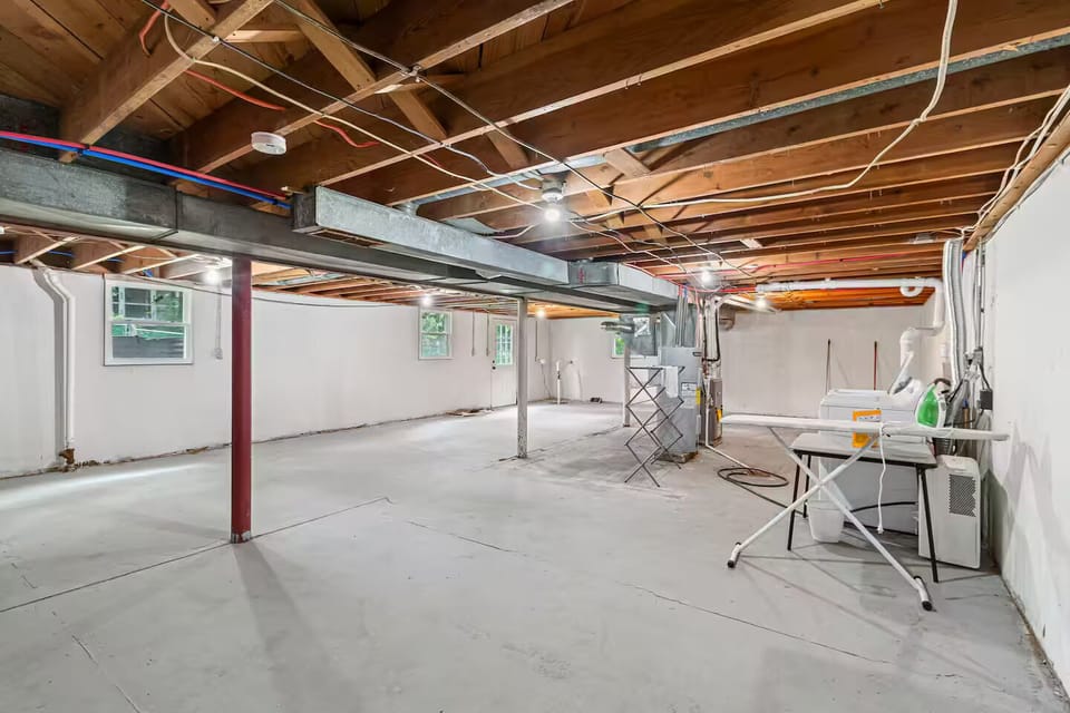 Basement laundry with washer and dryer
