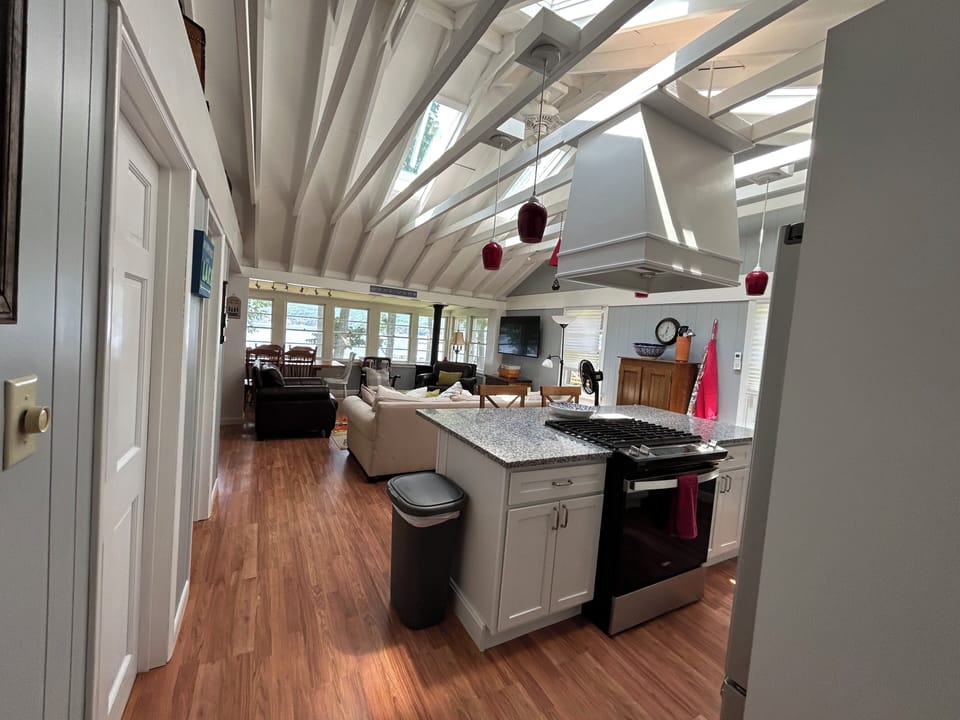 View of kitchen and living area from the hallway.
