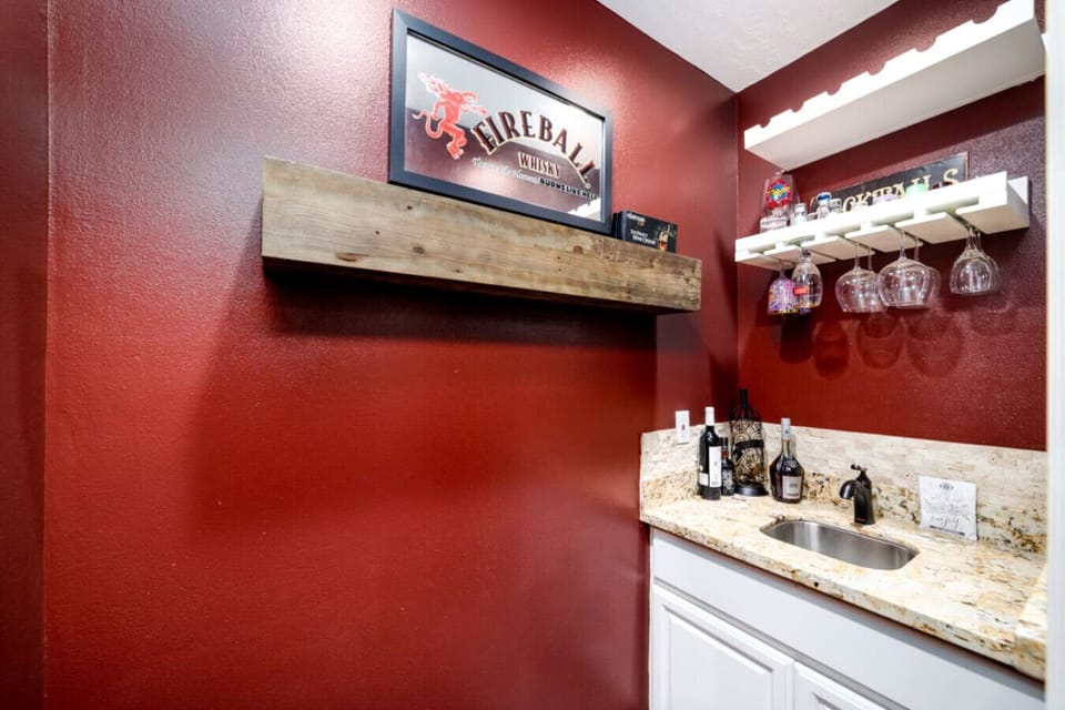 Compact bar nook featuring elegant finishes and glassware — a great touch for entertaining.