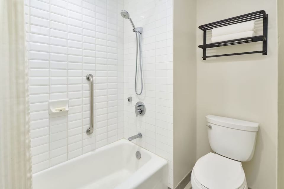 Rinse off easily with a simple, spotless shower-tub combo.