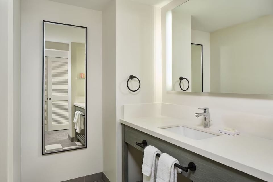 Get ready effortlessly with a spacious vanity and bright mirror.