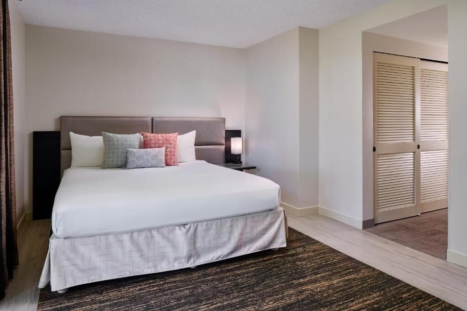 Recharge in a serene bed with crisp, inviting linens.