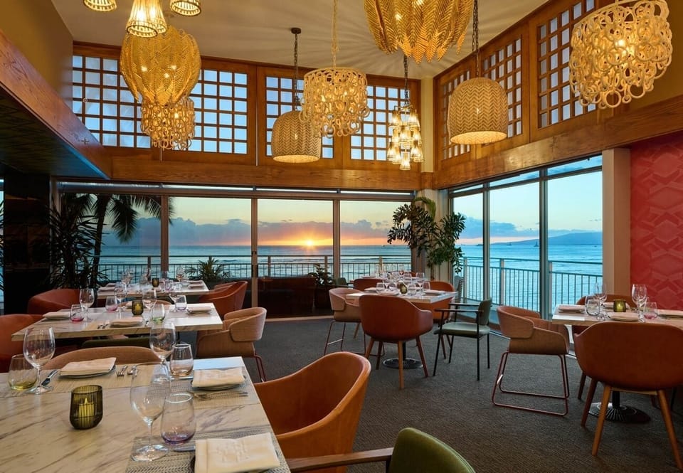 Toast the sunset with oceanfront dining and golden light.