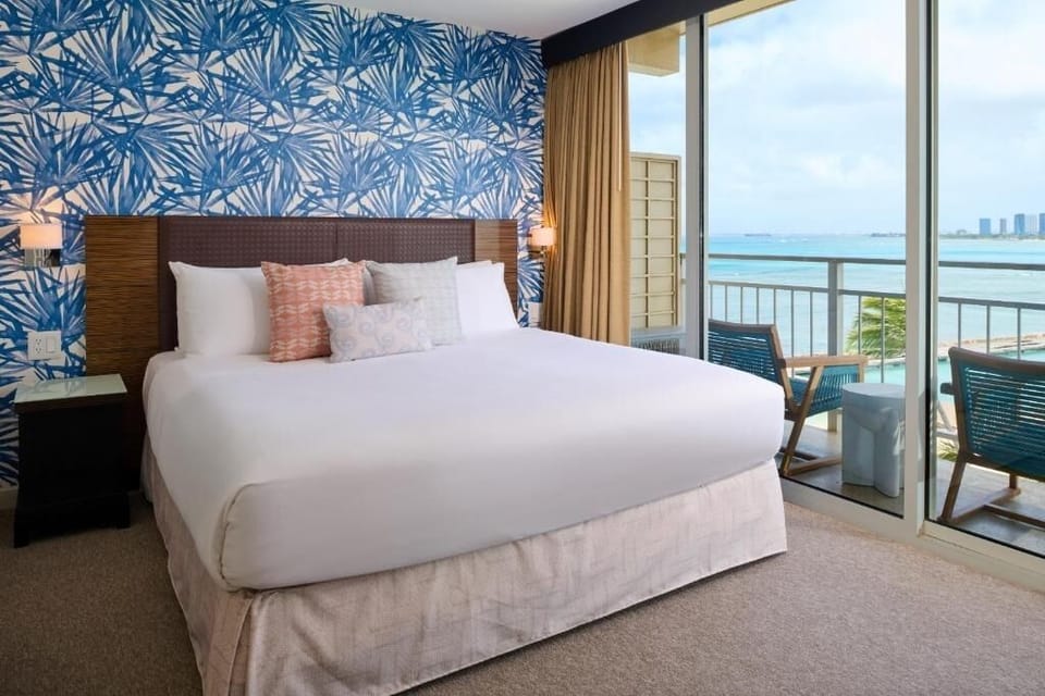 Wake up to ocean breezes from your bed and balcony.