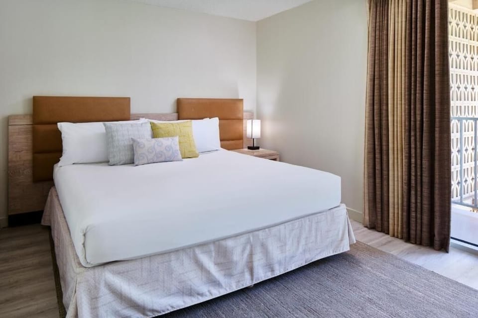 Drift off in crisp linens after a sun-soaked day.