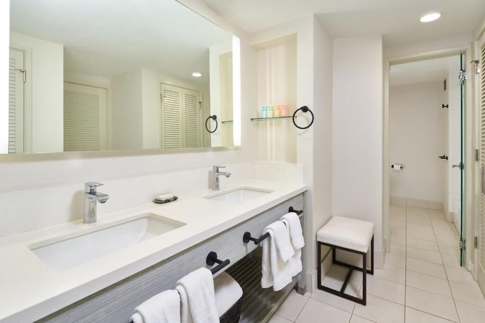 Refresh together at the double vanity with bright, clean lighting.