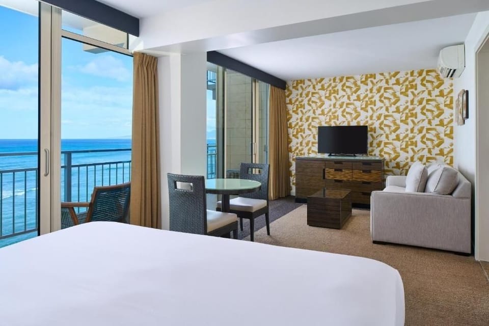 Stretch out in a spacious suite with ocean views beyond.