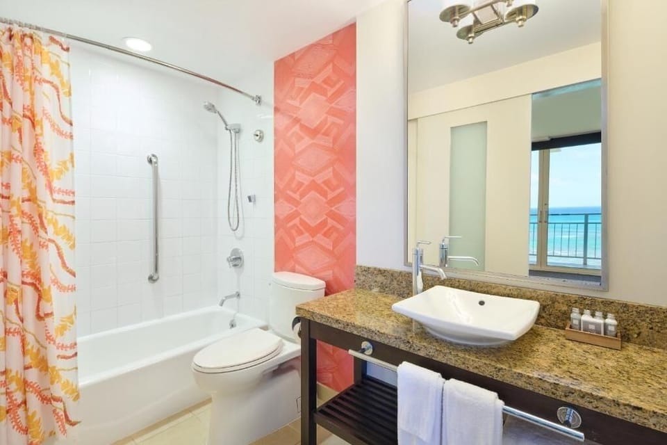 Refresh in a bright bath with spa-like granite vanity.