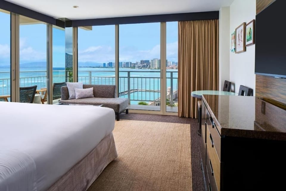 Settle in with in-room lounging and sweeping coastline scenery.