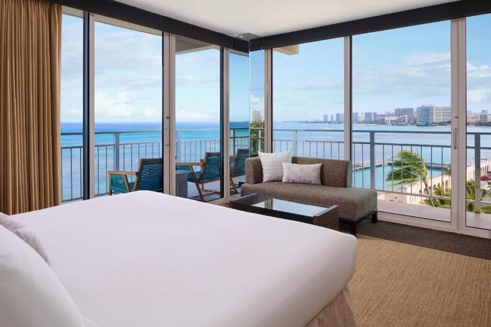 Wake up to panoramic ocean views from your plush bed.