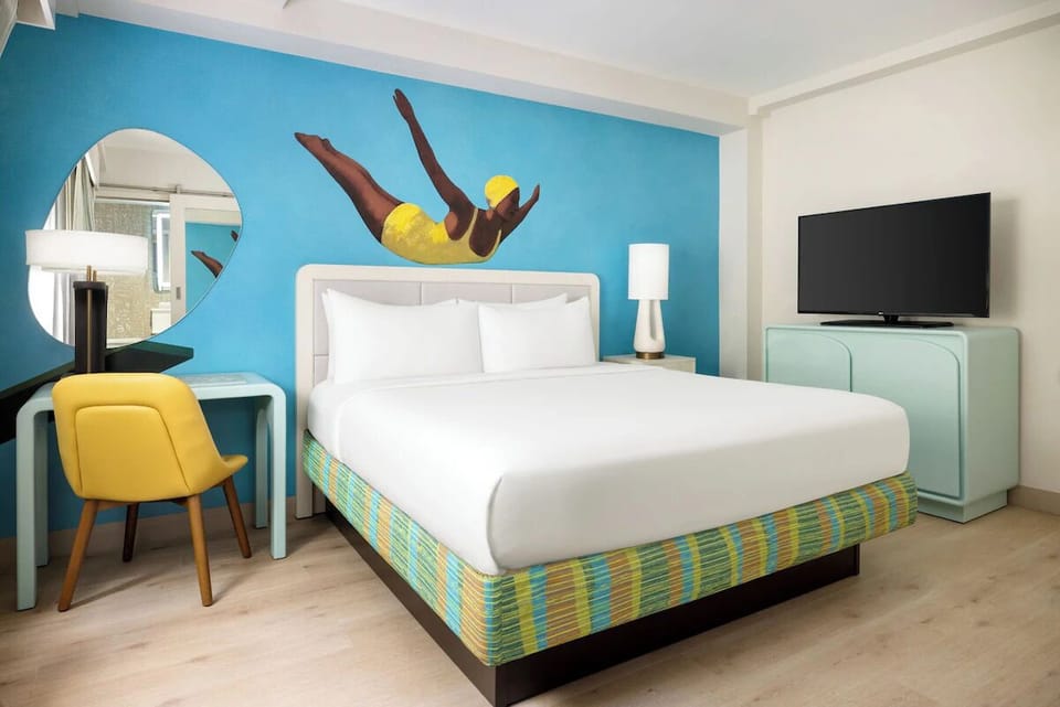 Unwind in a bright, artful room with sleek comforts.