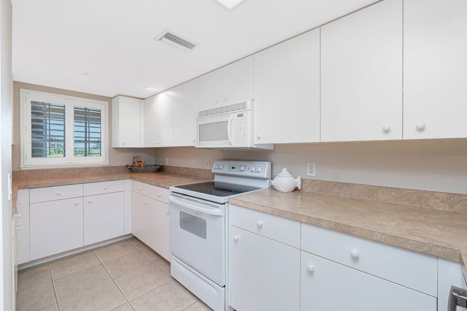 Kitchen with stove for home-cooked meals.`