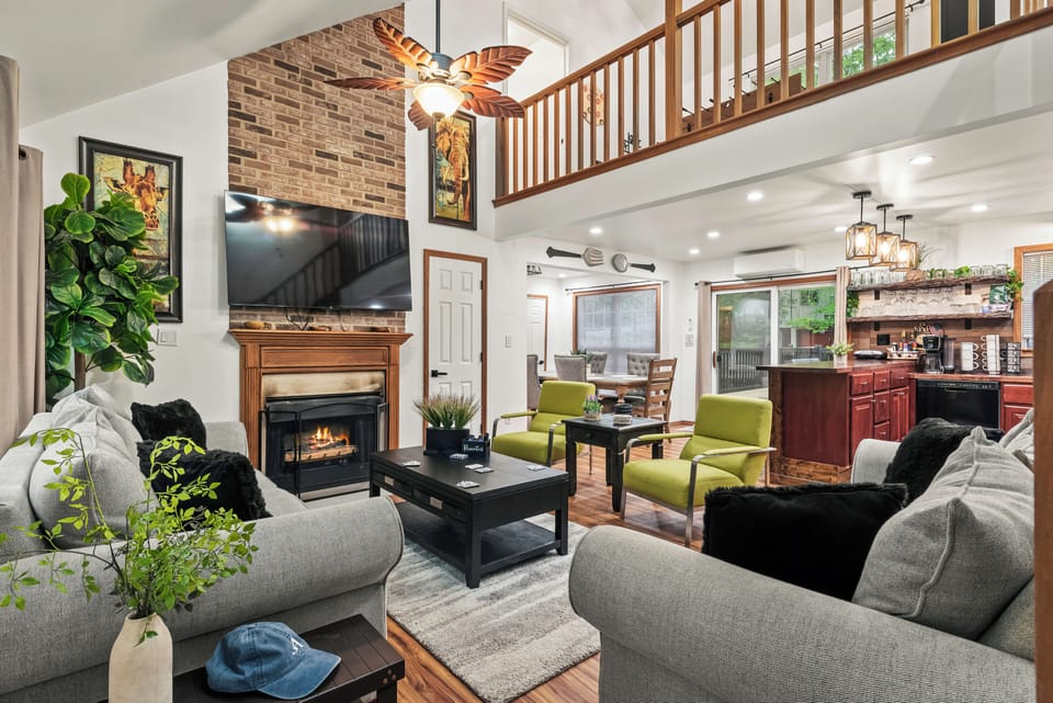 Bright and airy living room with a cozy fireplace—perfect for relaxing after a day of adventure.