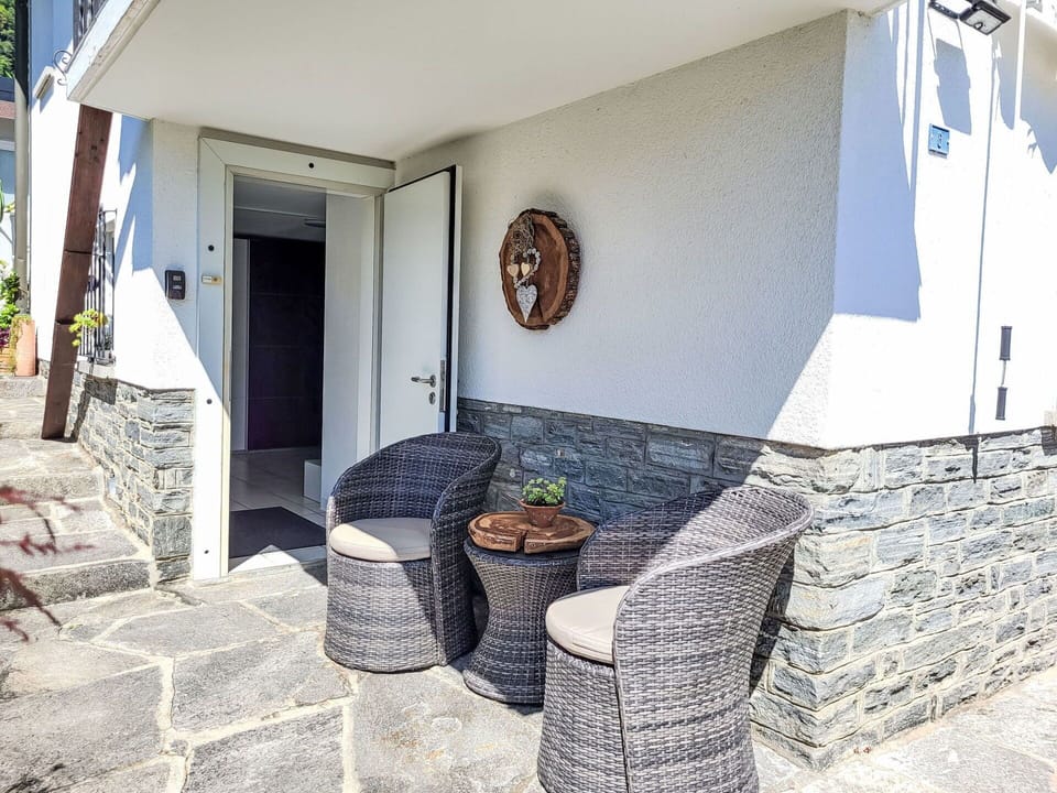 Porch, Door, Outdoor Furniture, Chair, Balcony, Concrete, Shade, Handrail, Fence, Houseplant