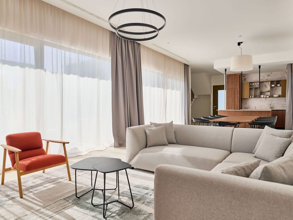 Furniture, Interior Design, Flooring, Floor, Couch, Living Room, Wood, Ceiling, Wood Flooring, Table