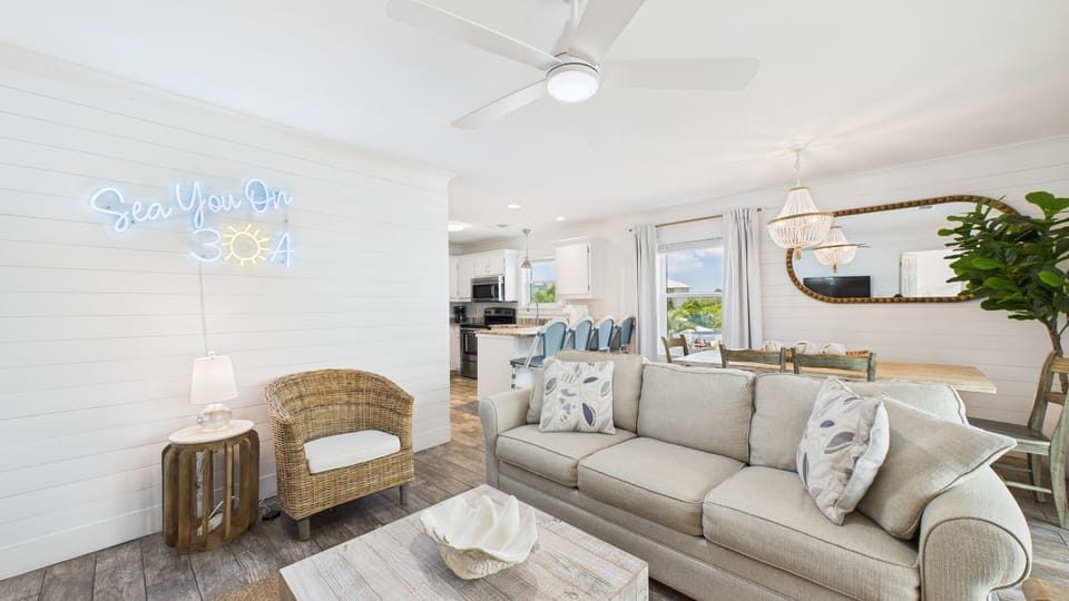 Open concept living area with stylish furnishings