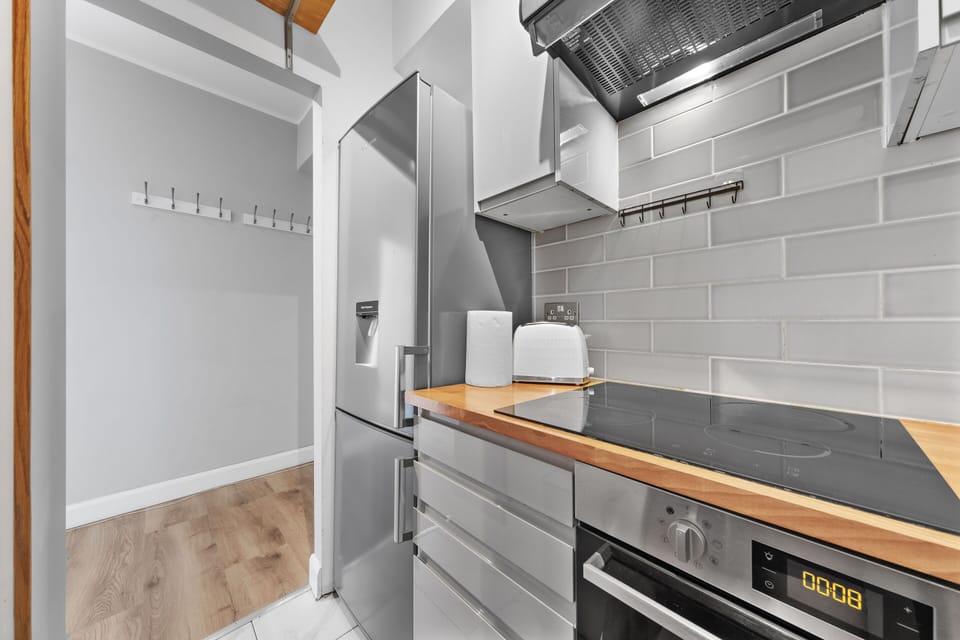 Cook with ease in this modern kitchen complete with quality appliances and smart storage solutions.