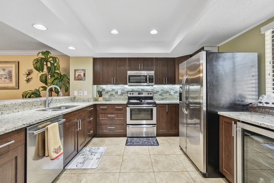 Granite counters, beverage cooler and stainless appliances.