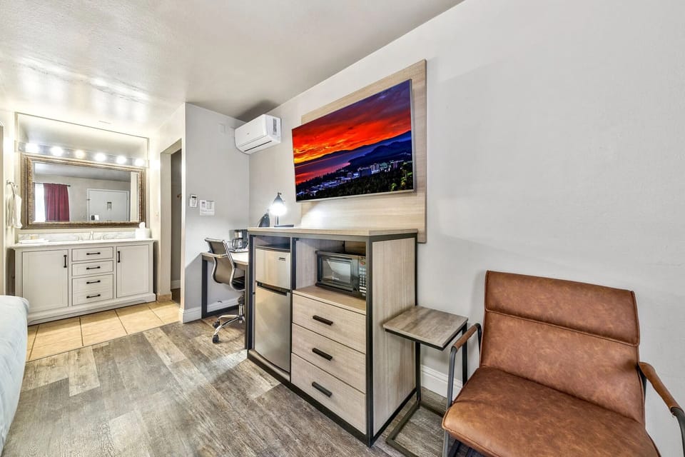 Unwind in a bright studio nook with handy mini-fridge.
