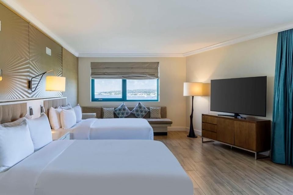Unit with 2 Double beds. Exact unit will be assigned upon arrival. Views, colors, and decor may vary.