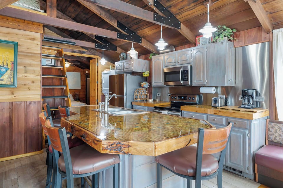 Kitchen stocked with all cooking essentials and a beautiful island bar with seating