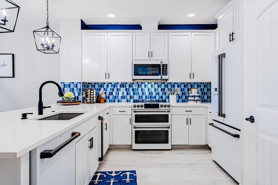 Sleek, spacious, and fully stocked—this kitchen is ready for your next meal.