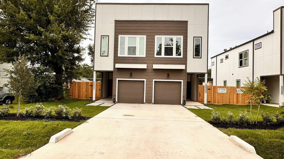 This listing is for the left townhome with the RED door