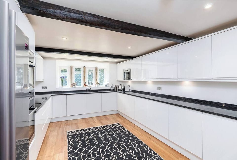 Built in dishwasher to the left of the sink.