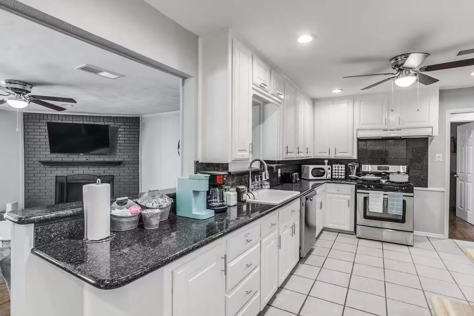 Eat-in kitchen, open to living room, board game room. Fully stocked coffee bar.