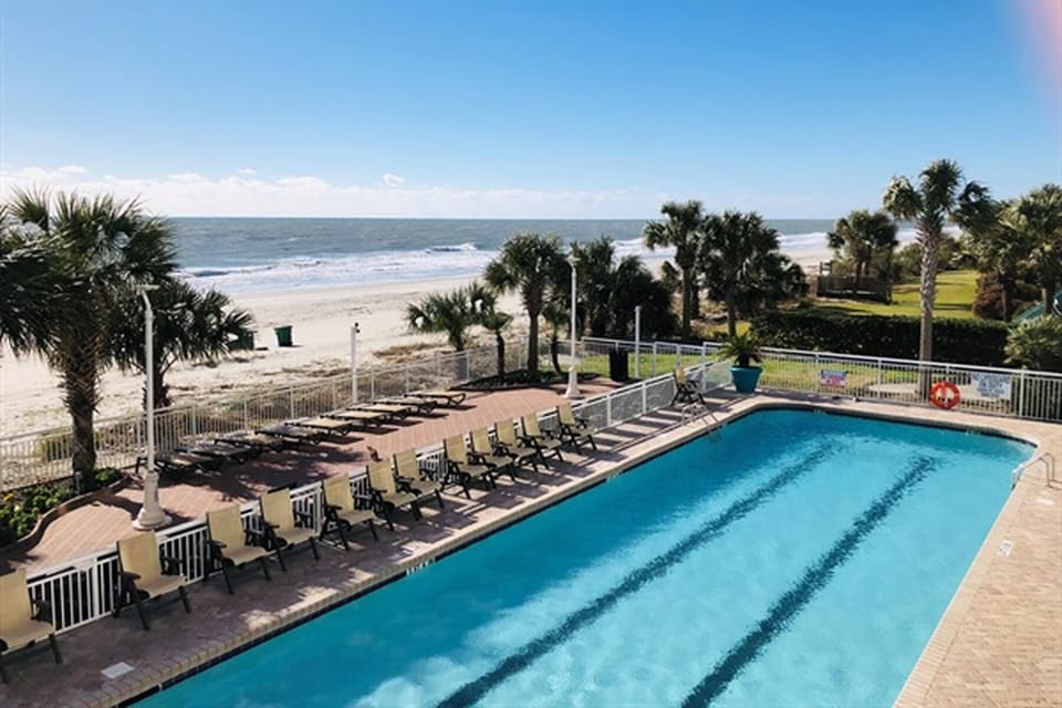 Dive into pure relaxation at the sparkling oceanfront pool.