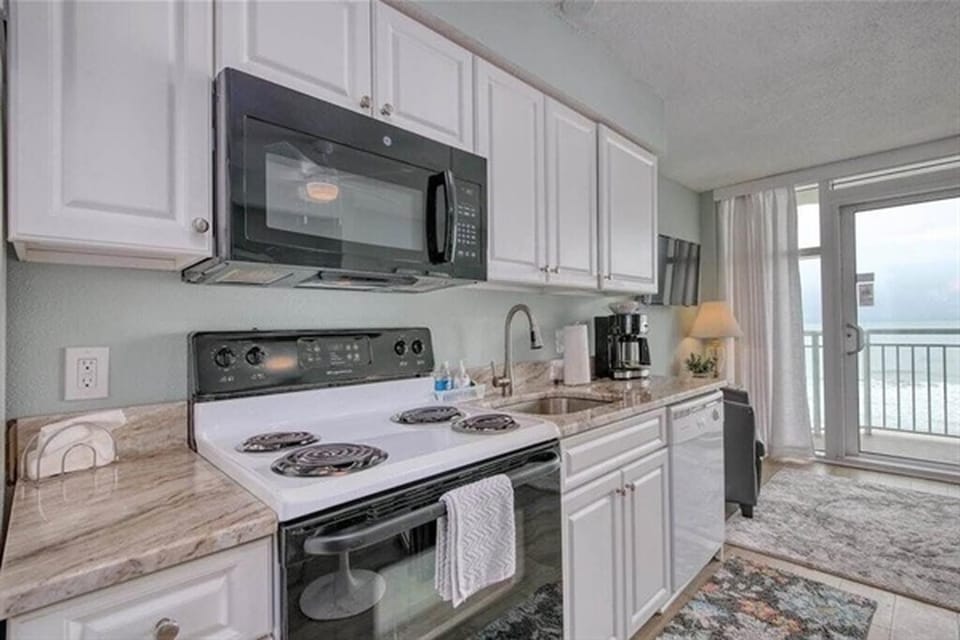 Granite countertops with full-size appliances for a sleek, modern kitchen.