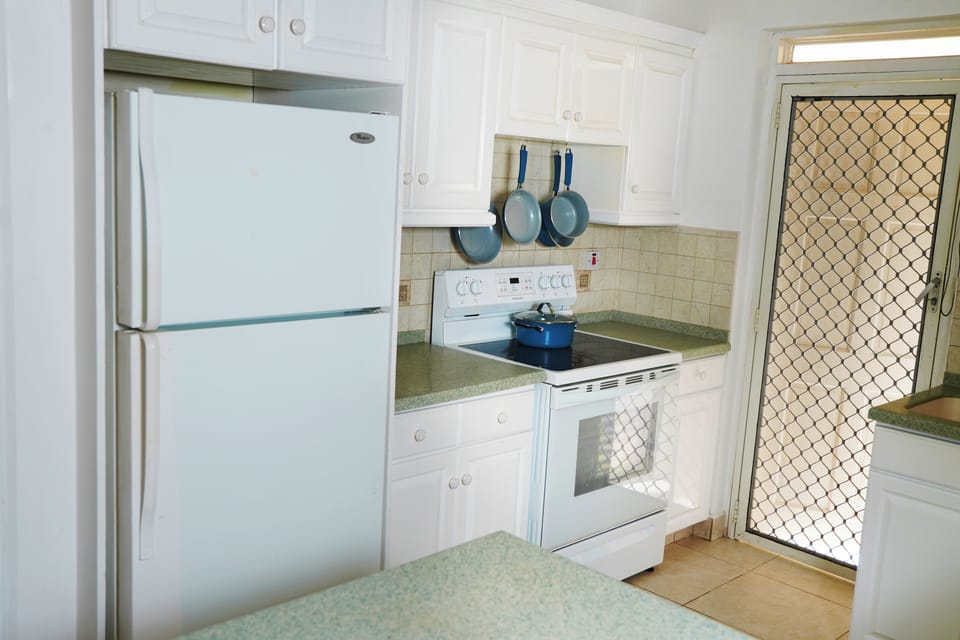 fridge, stove, pots and pans