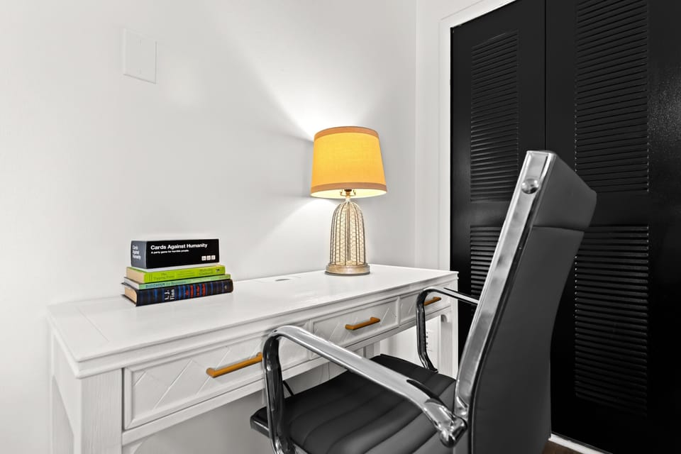 This sleek, clutter-free desk setup with ergonomic seating is tailored for focused work and efficient planning.